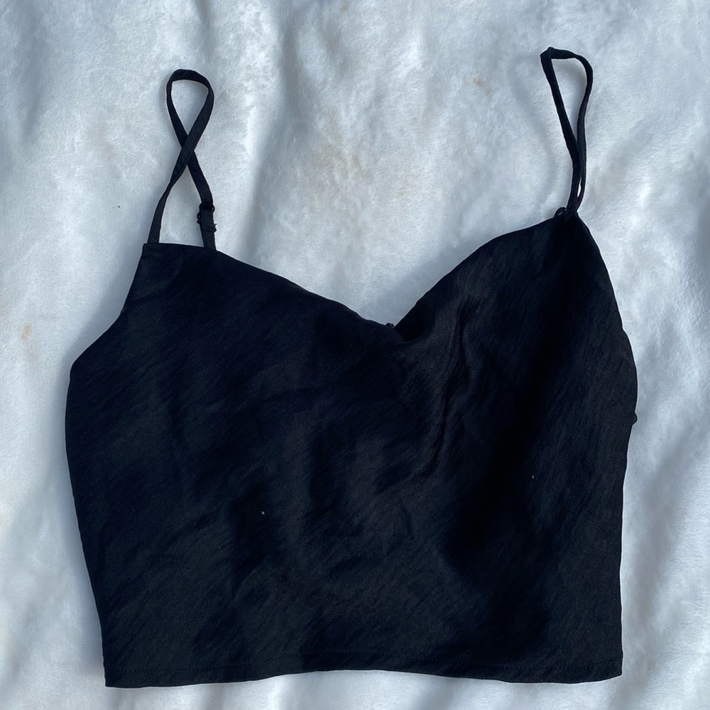 Silky, black dressy crop top with a swooshy in front, zipper in the back detail